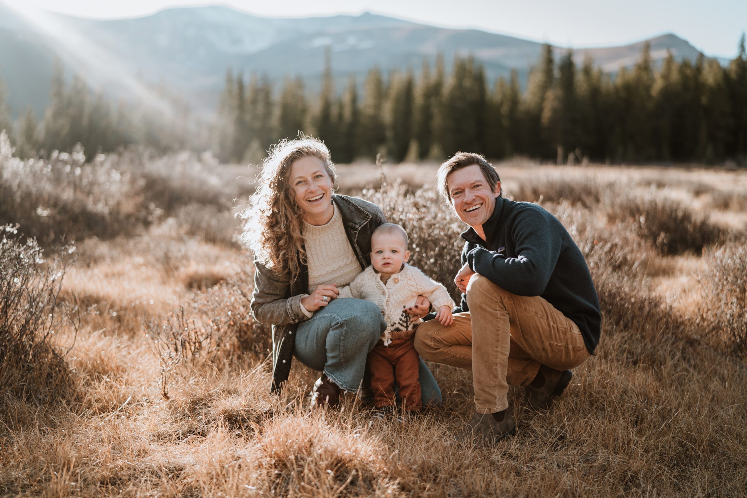 A sweet family of three dressed casually for their fall family photos in Fairplay Colorado by Basecamp Visual.